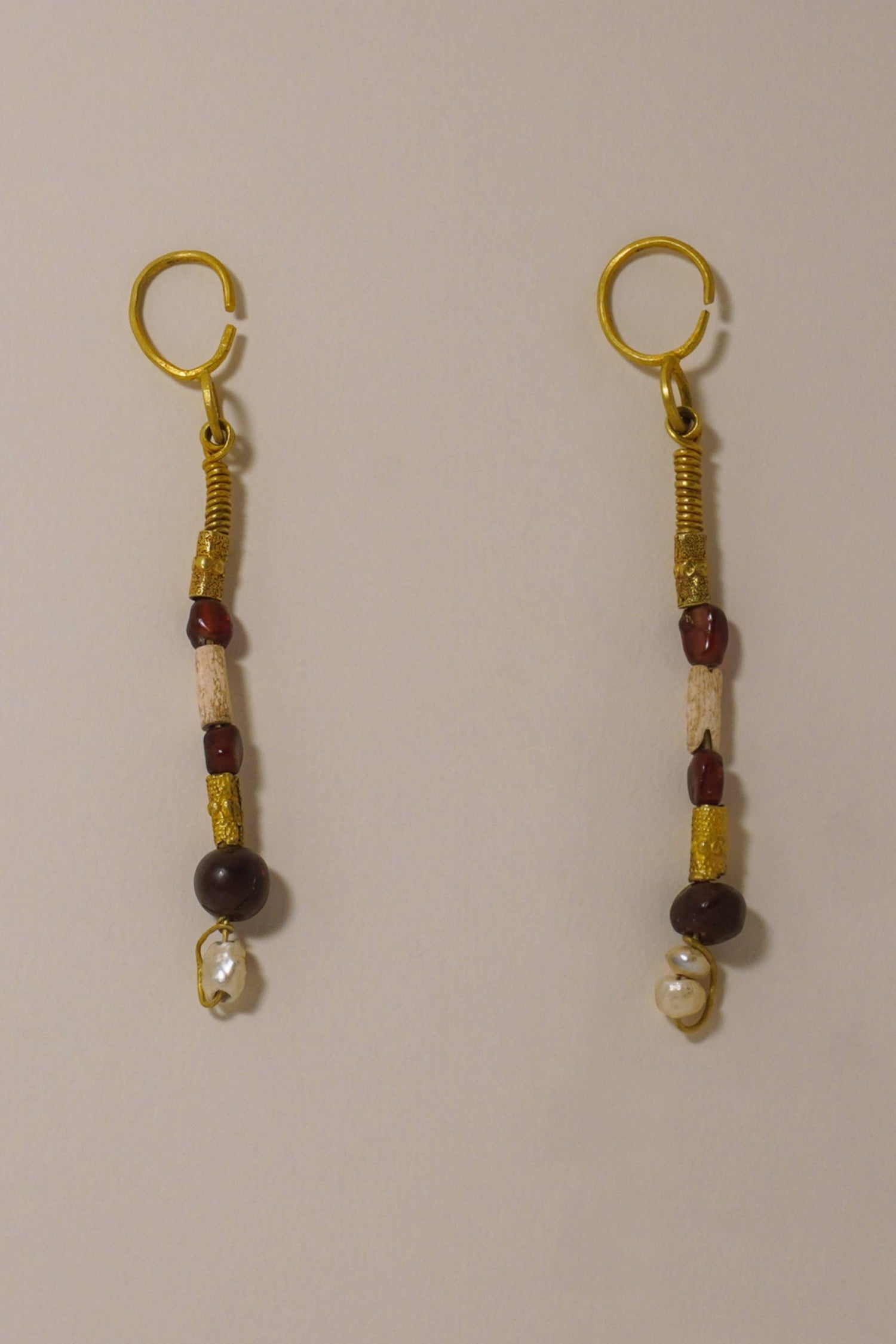 ANCIENT WESTERN ASIATIC GOLD DROP EARRINGS WITH GARNET, CORAL AND PEARL BEADING. 1ST MILLENNIUM BC